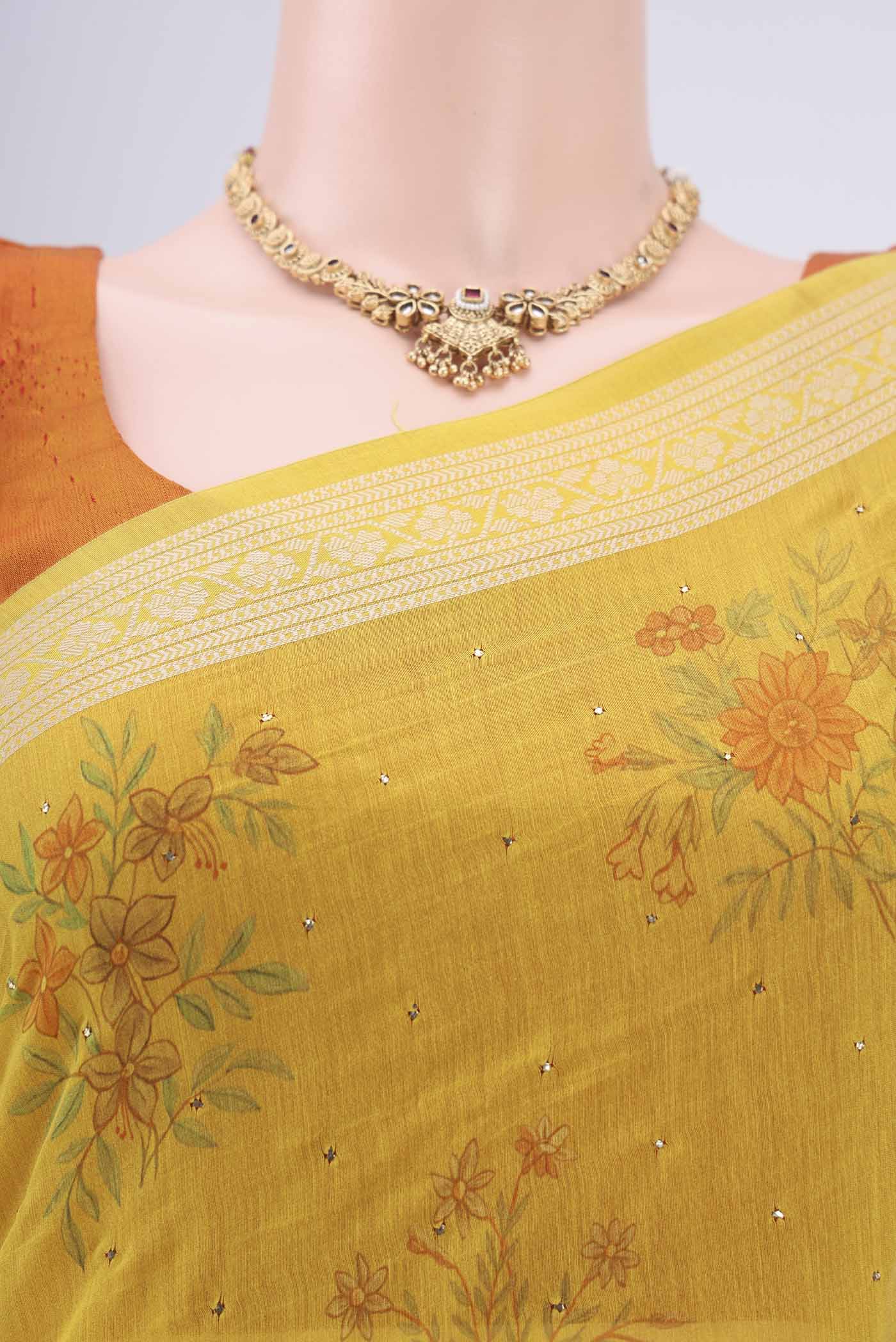 Border image of Yellow Chanderi Silk Saree with Printed design on the body and Thread Border. 