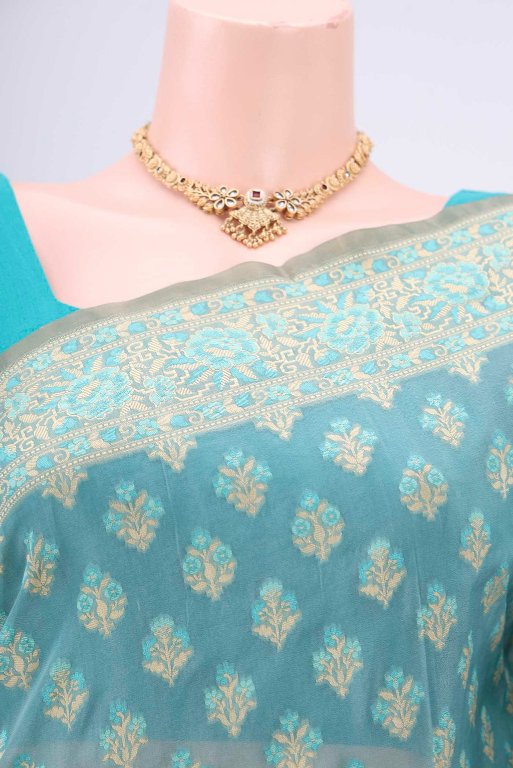 Border image of Sky Blue Banarasi Silk Saree with Zari And Thread Butta on the body and Zari Border. 