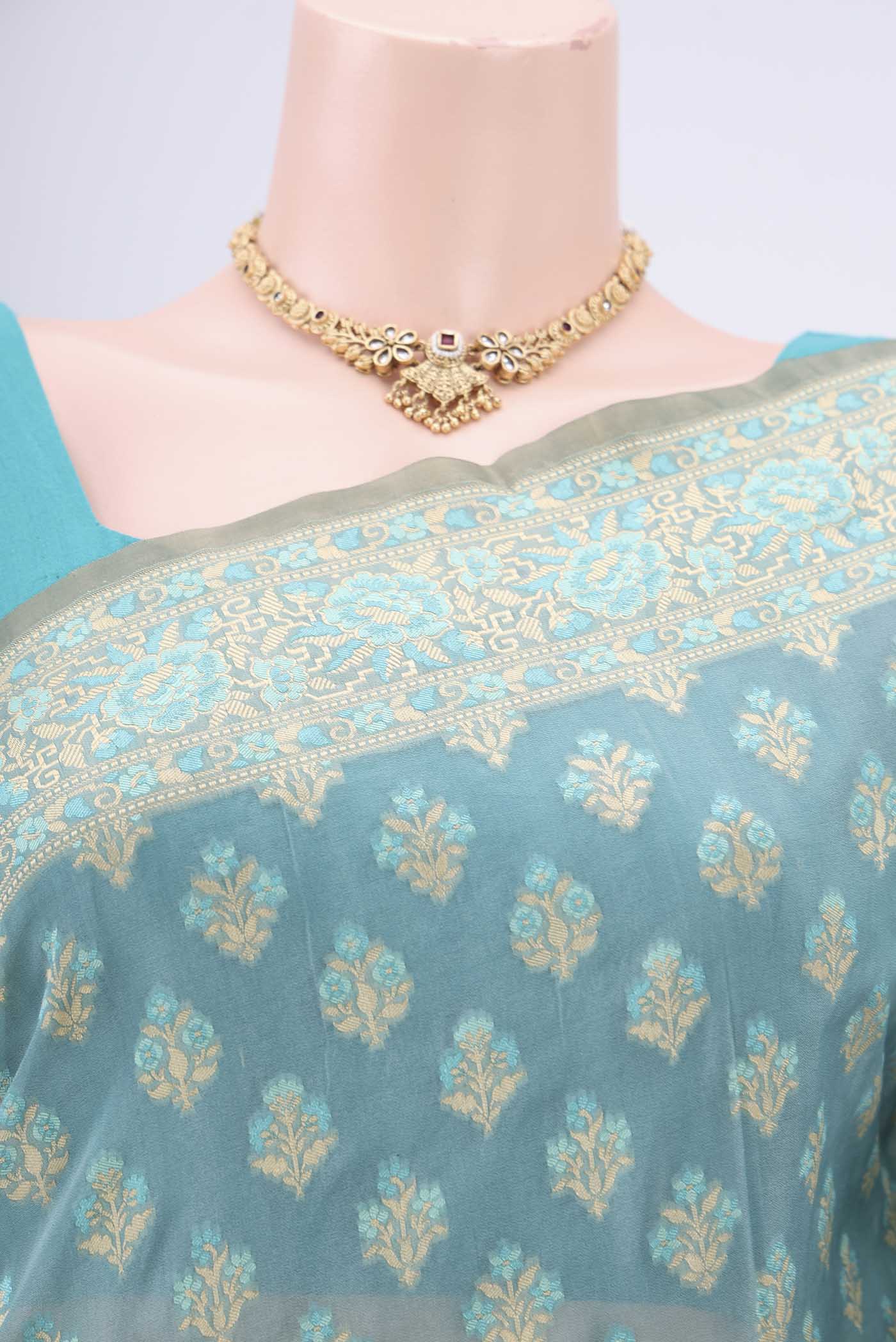 Border image of Sky Blue Banarasi Silk Saree with Zari And Thread Butta on the body and Zari Border. 