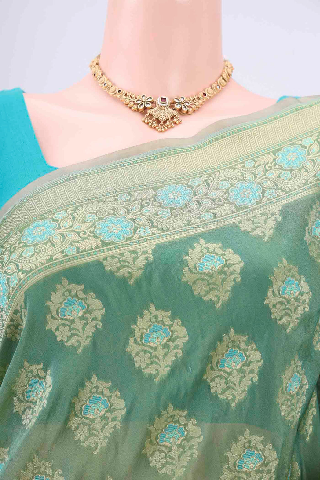 Border image of Mint Green Banarasi Silk Saree with Zari And Thread Butta on the body and Zari Border. 