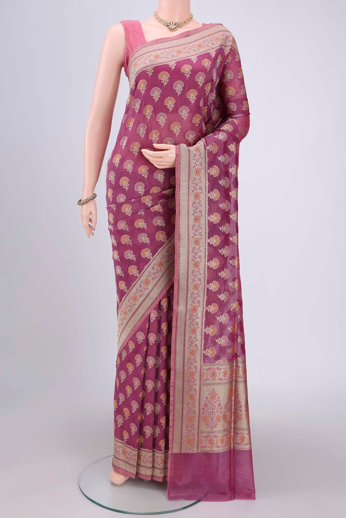 Light Magenta Banarasi Silk Saree with Zari And Thread Butta on the body and Zari Border.  displayed on a mannequin