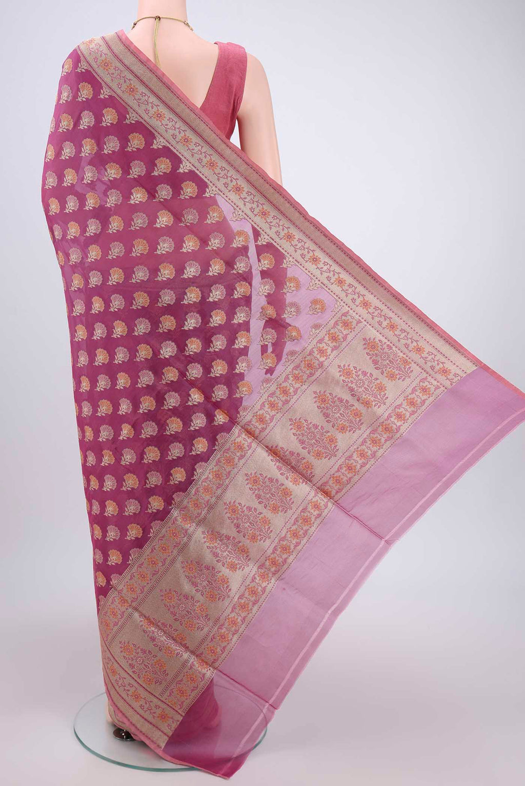 Flat view of Light Magenta Banarasi Silk Saree with Zari And Thread Butta on the body and Zari Border. 