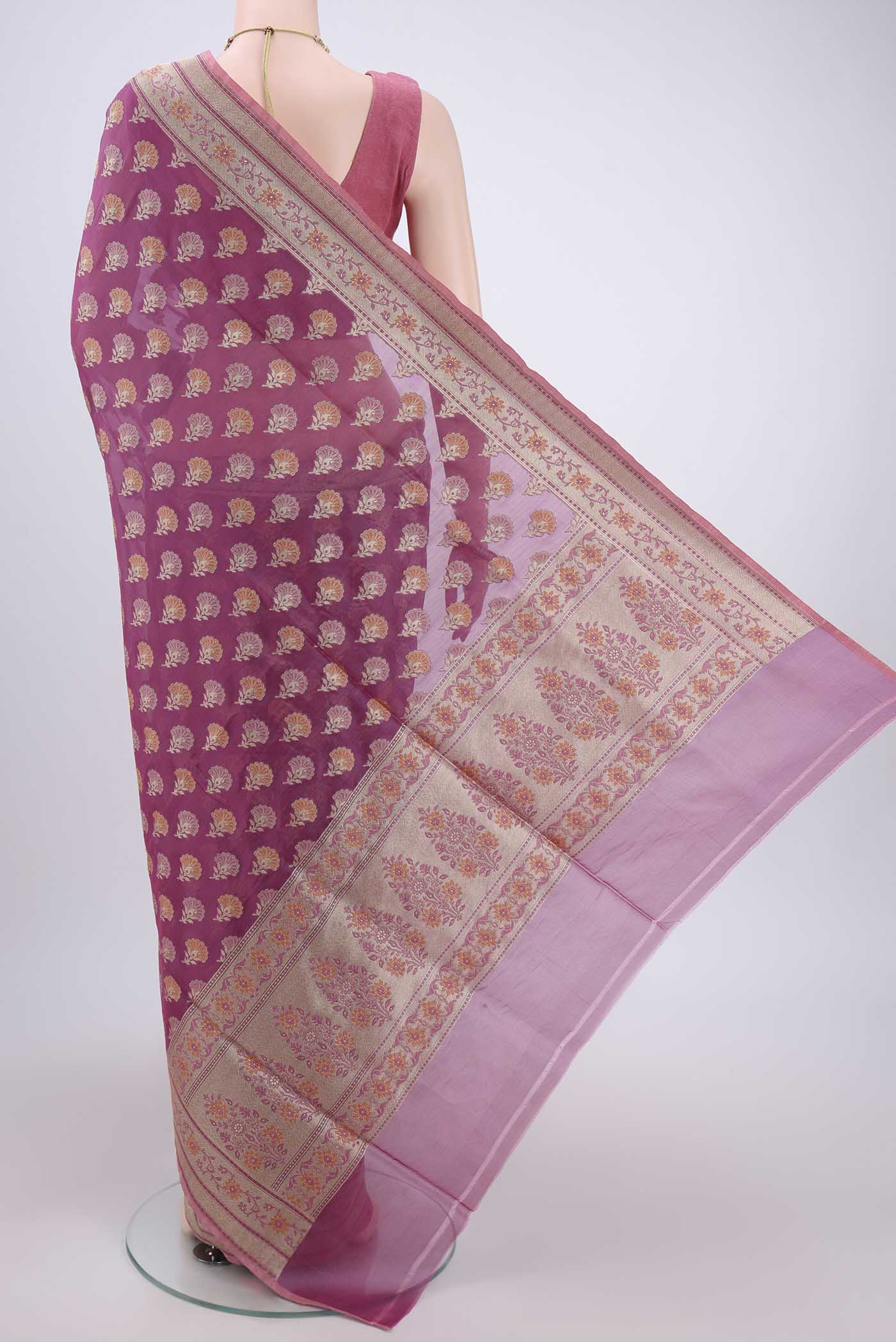 Flat view of Light Magenta Banarasi Silk Saree with Zari And Thread Butta on the body and Zari Border. 