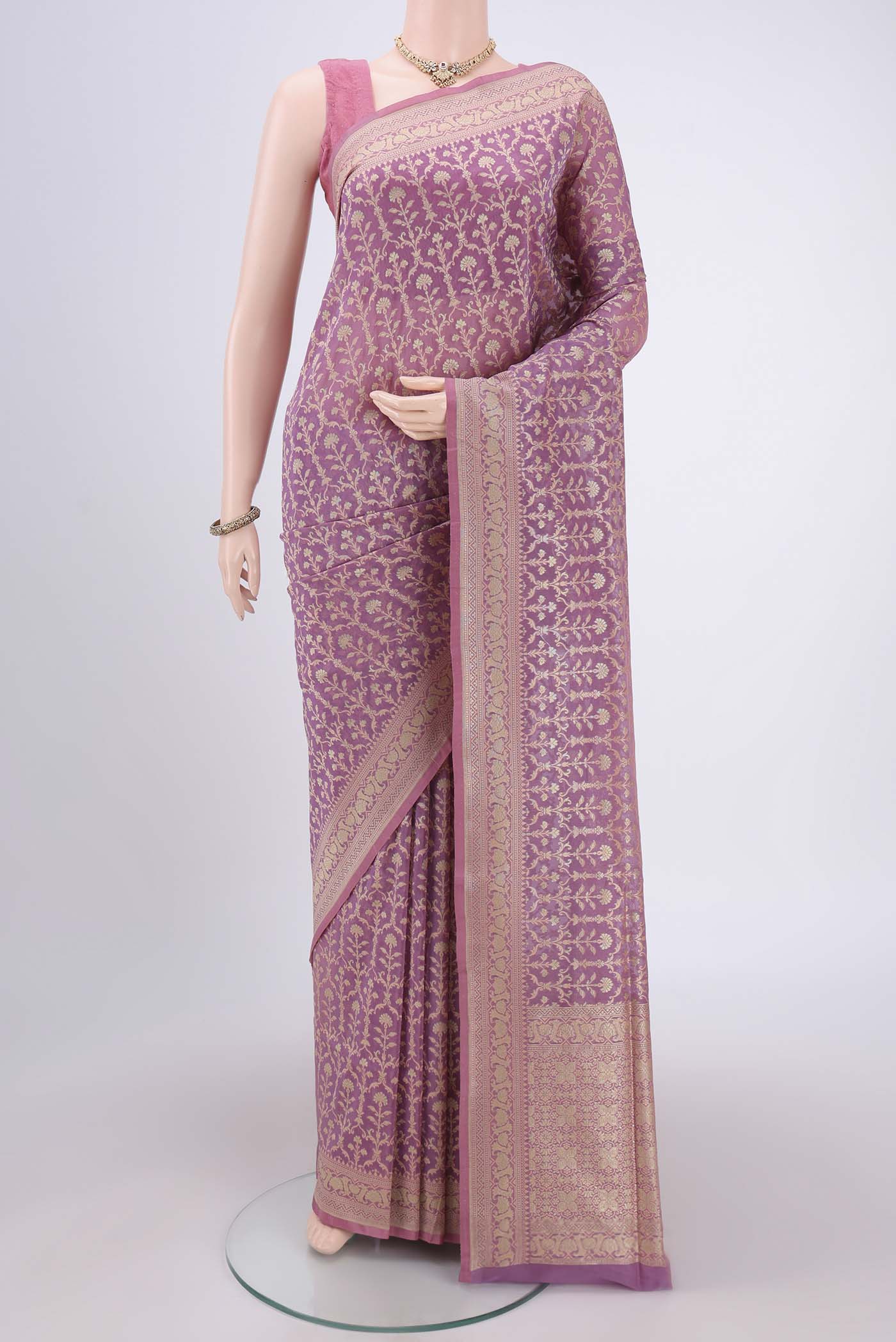 Purple Banarasi Silk Saree with Zari And Thread Butta on the body and Zari Border.  displayed on a mannequin