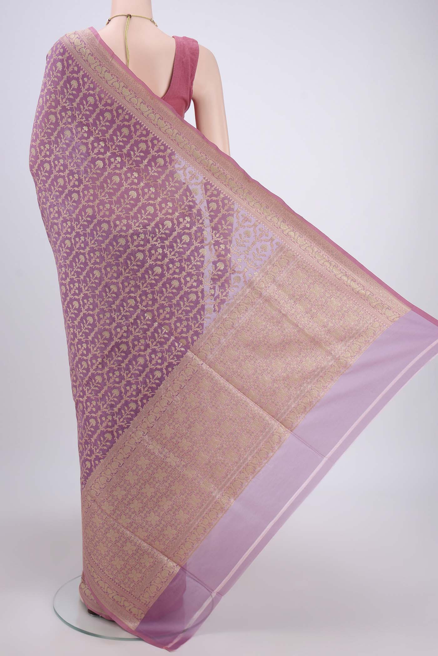 Flat view of Purple Banarasi Silk Saree with Zari And Thread Butta on the body and Zari Border. 