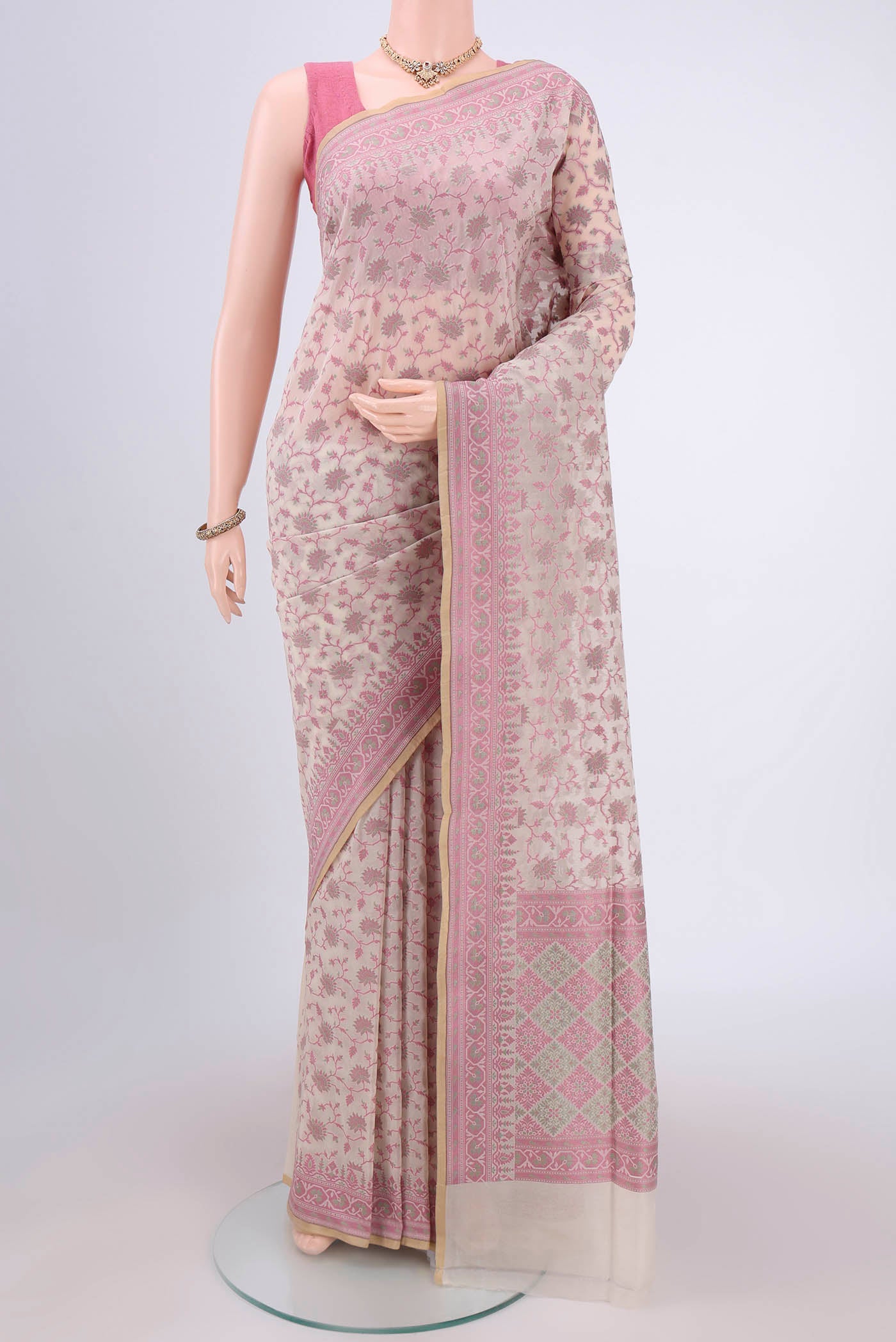 Off White Banarasi Silk Saree with Thread Butta on the body and Zari Border.  displayed on a mannequin