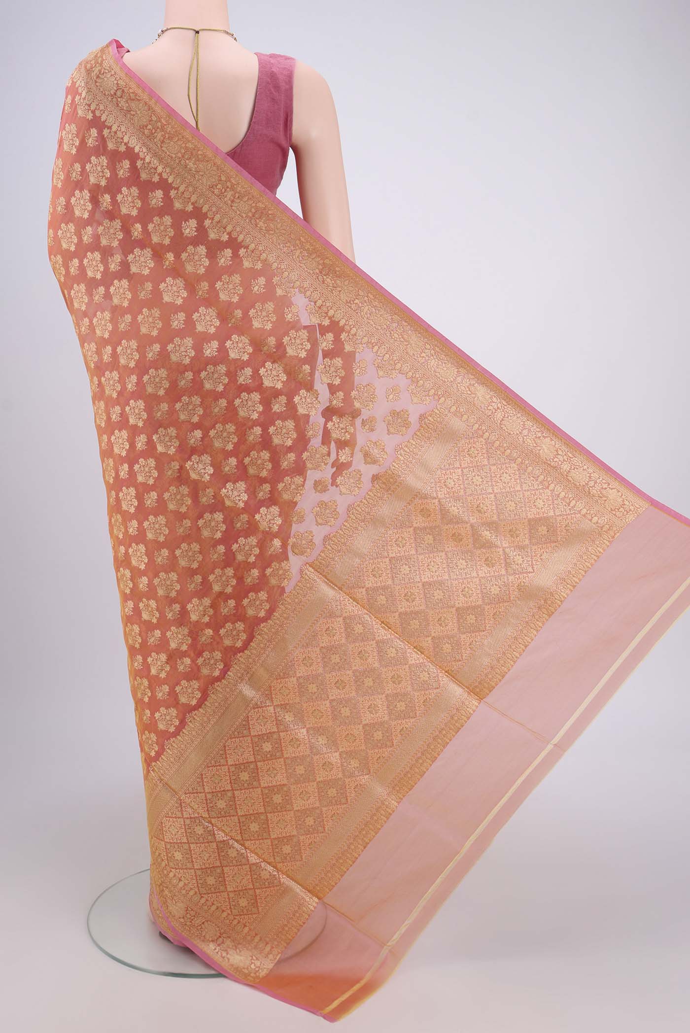 Flat view of Brick Orange Dual Tone Banarasi Silk Saree with Zari Butta on the body and Zari Border. 