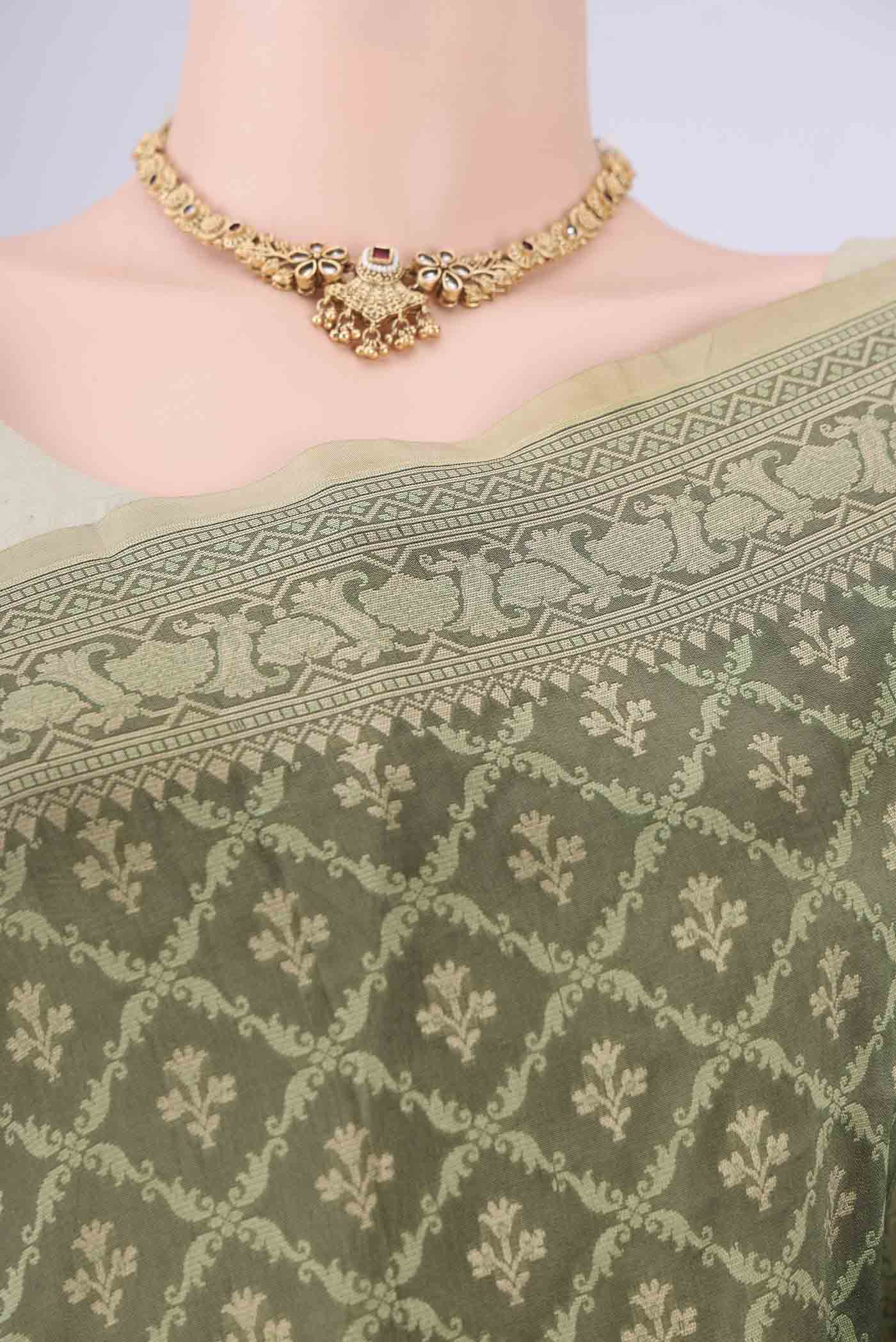 Border image of Olive Green Banarasi Silk Saree with Jacquard With Zari Butta on the body and Zari Border. 