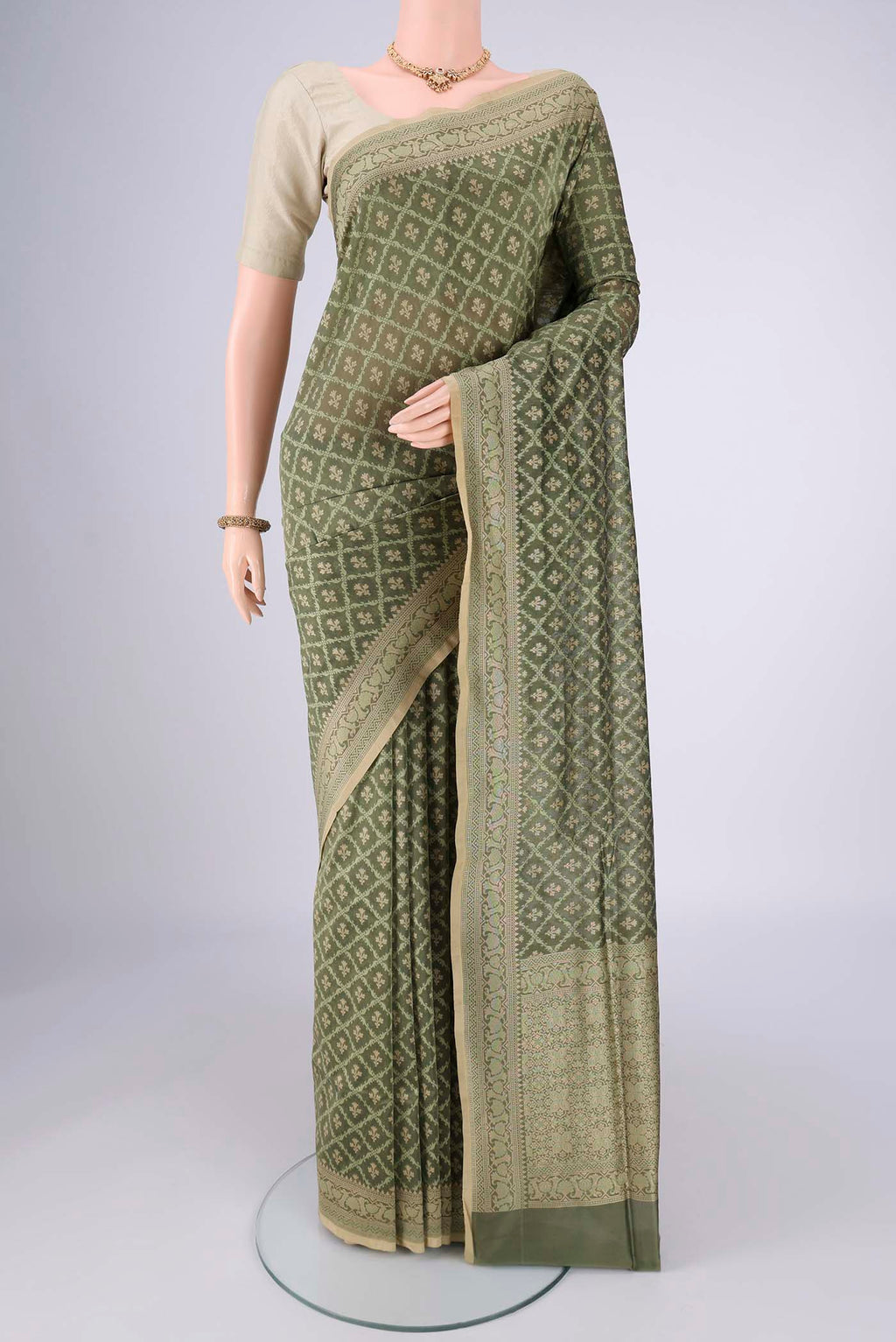 Olive Green Banarasi Silk Saree with Jacquard With Zari Butta on the body and Zari Border.  displayed on a mannequin