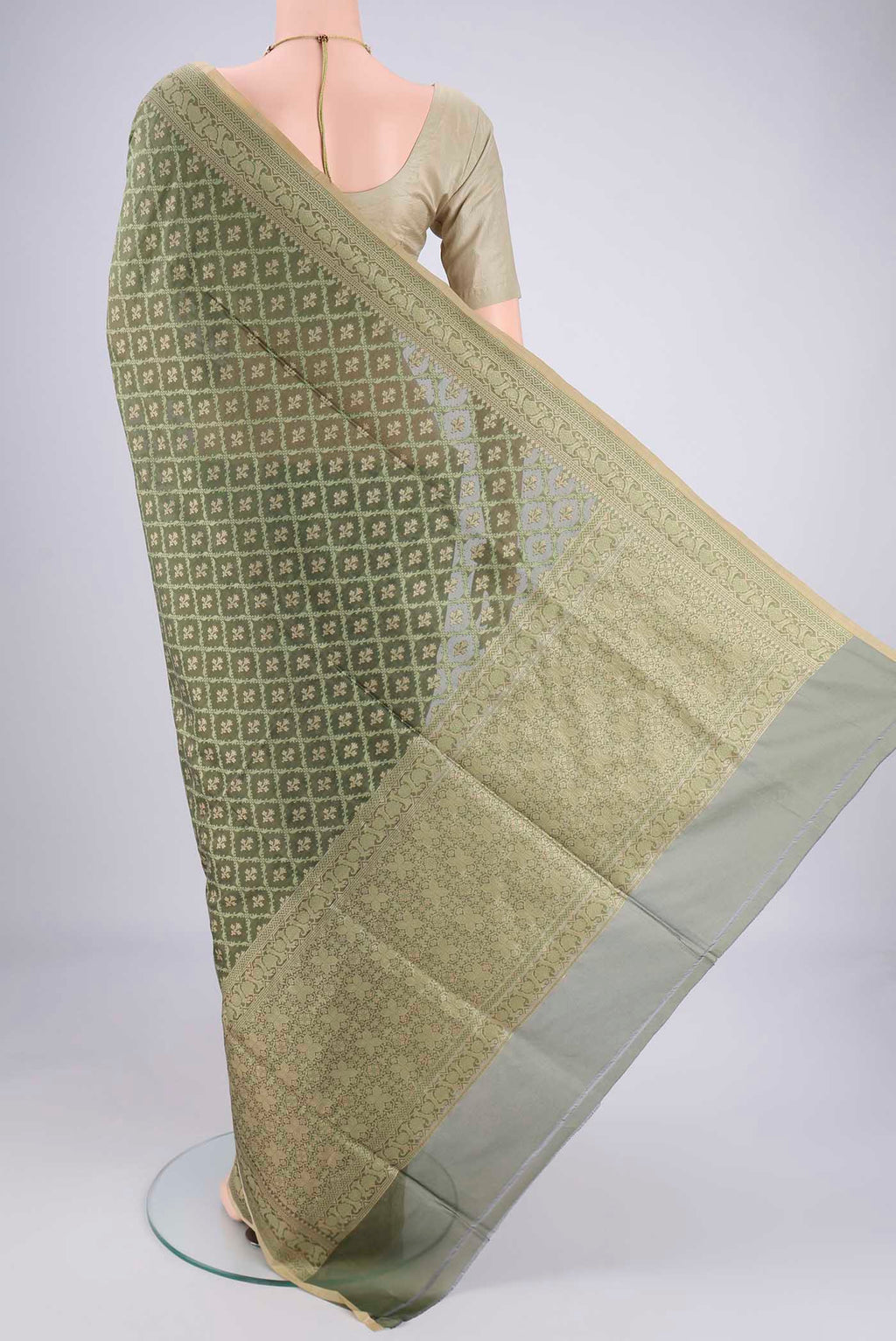 Flat view of Olive Green Banarasi Silk Saree with Jacquard With Zari Butta on the body and Zari Border. 
