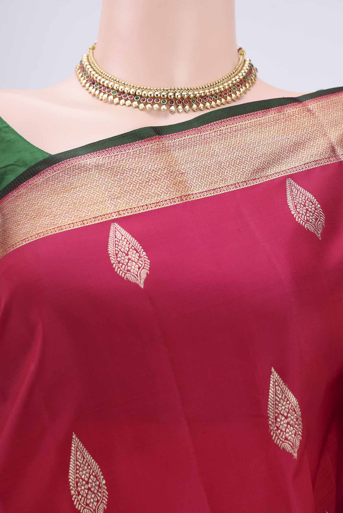 Border image of Rani Pink Kanjivaram Silk Saree with Zari Butta on the body and Zari Border. 