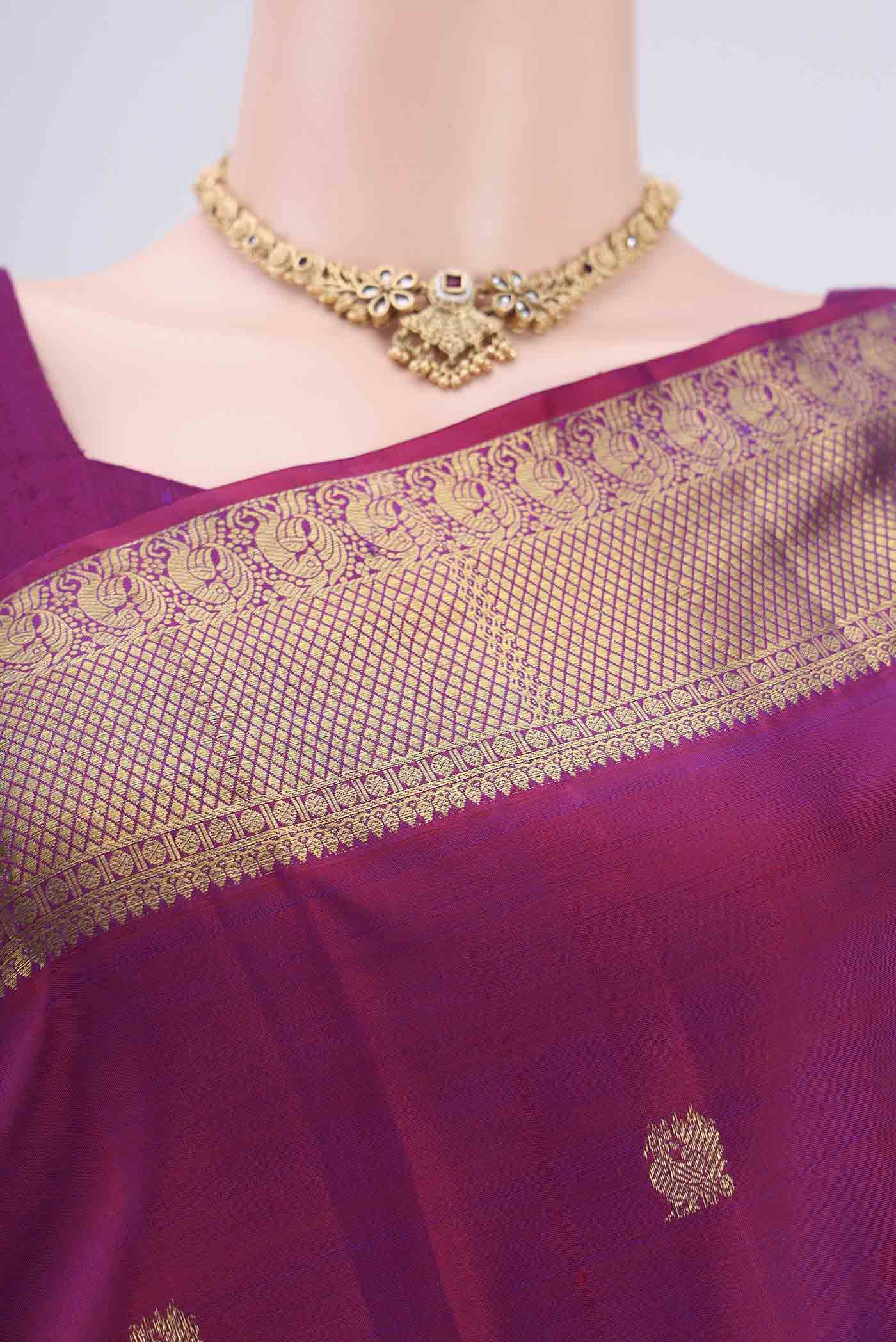 Border image of Magenta Kanjivaram Silk Saree with Zari Butta on the body and Zari Border. 