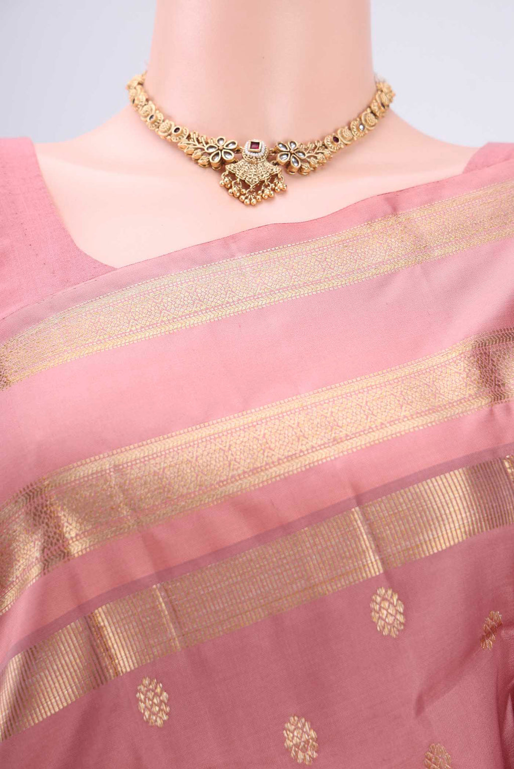 Border image of Mauve Kanjivaram Silk Saree with Zari Butta on the body and Zari Border. 