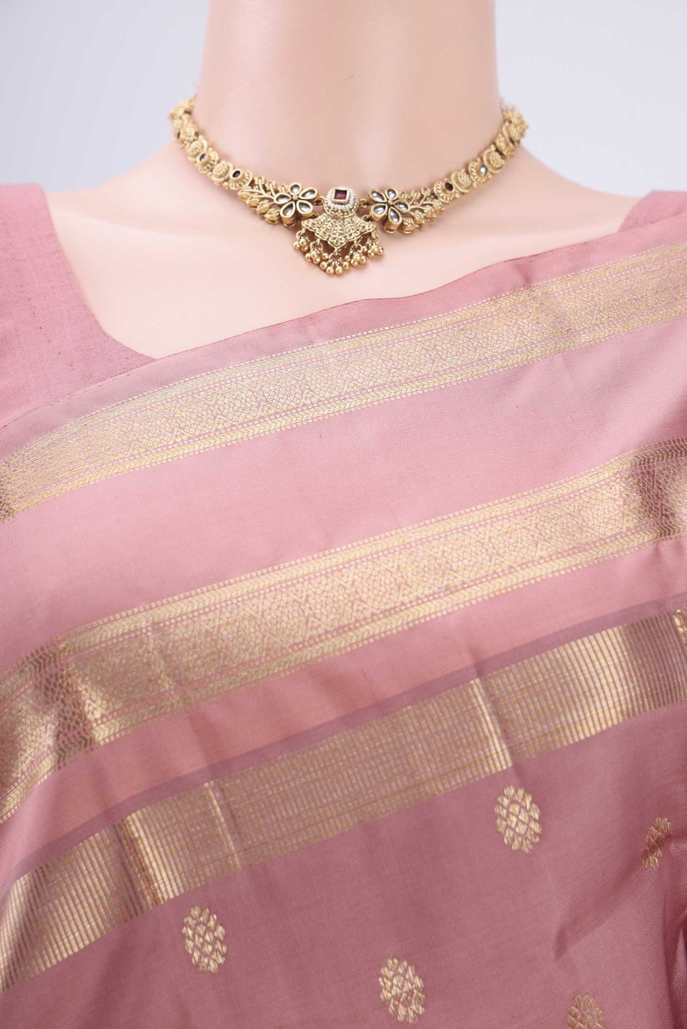 Border image of Mauve Kanjivaram Silk Saree with Zari Butta on the body and Zari Border. 
