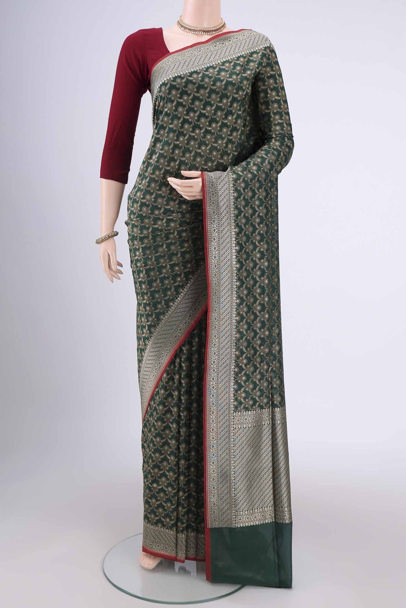 Bottle Green Banarasi Silk Saree with Jacquard With Zari Butta on the body and Zari Border.  displayed on a mannequin