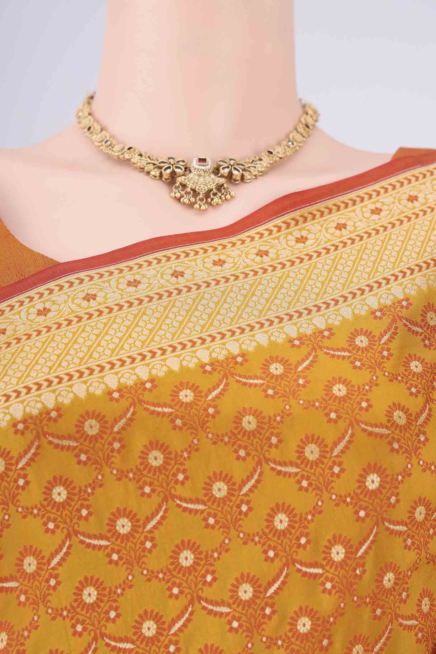 Border image of Mustard Banarasi Silk Saree with Jacquard With Zari Butta on the body and Zari Border. 