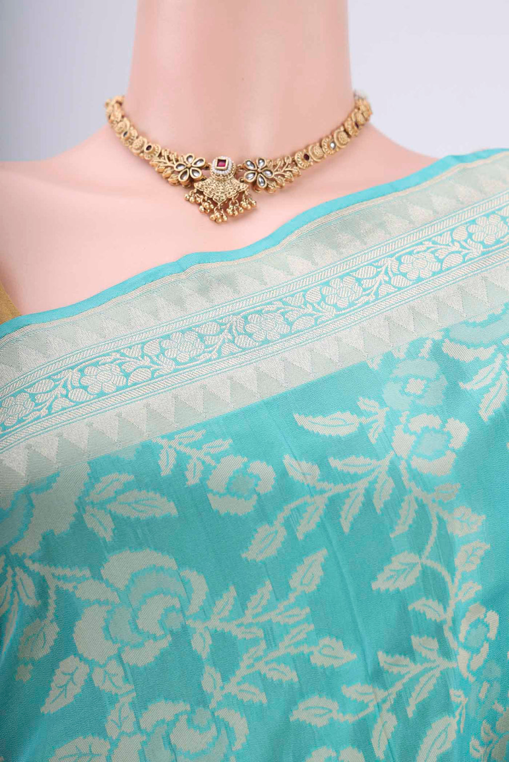 Border image of Sky Blue Banarasi Silk Saree with Zari And Thread Butta on the body and Zari Border. 