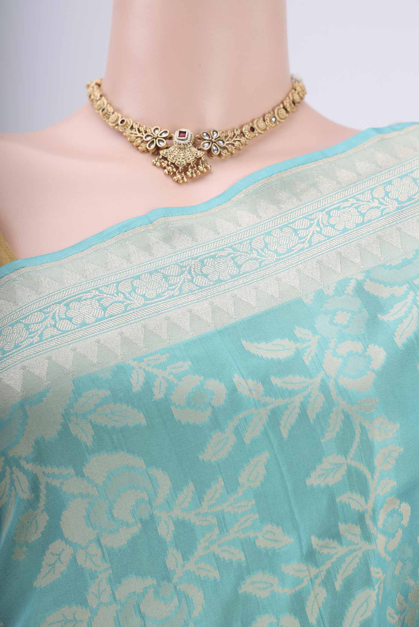 Border image of Sky Blue Banarasi Silk Saree with Zari And Thread Butta on the body and Zari Border. 