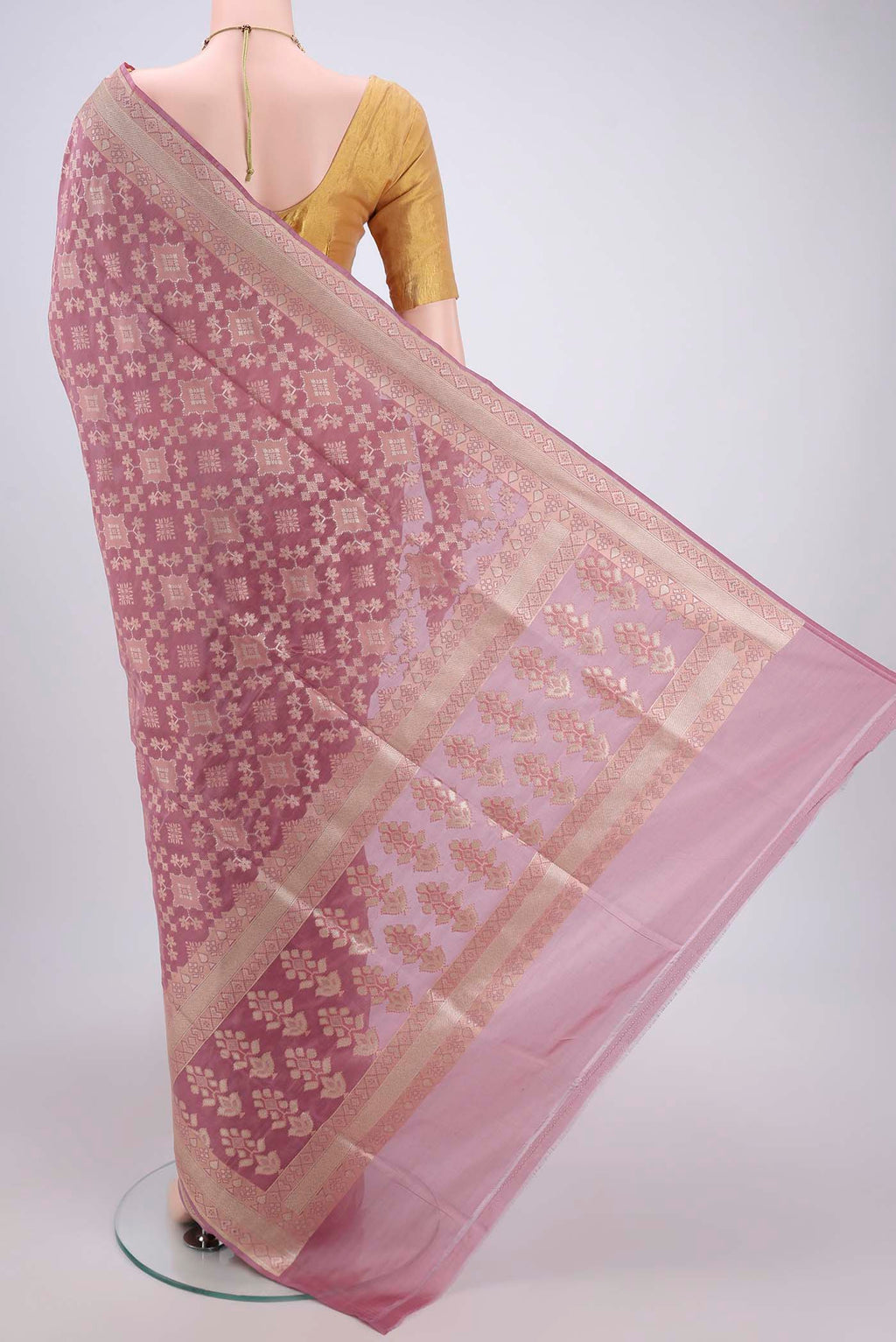Flat view of Mauve Banarasi Silk Saree with Zari And Thread Butta on the body and Zari Border. 