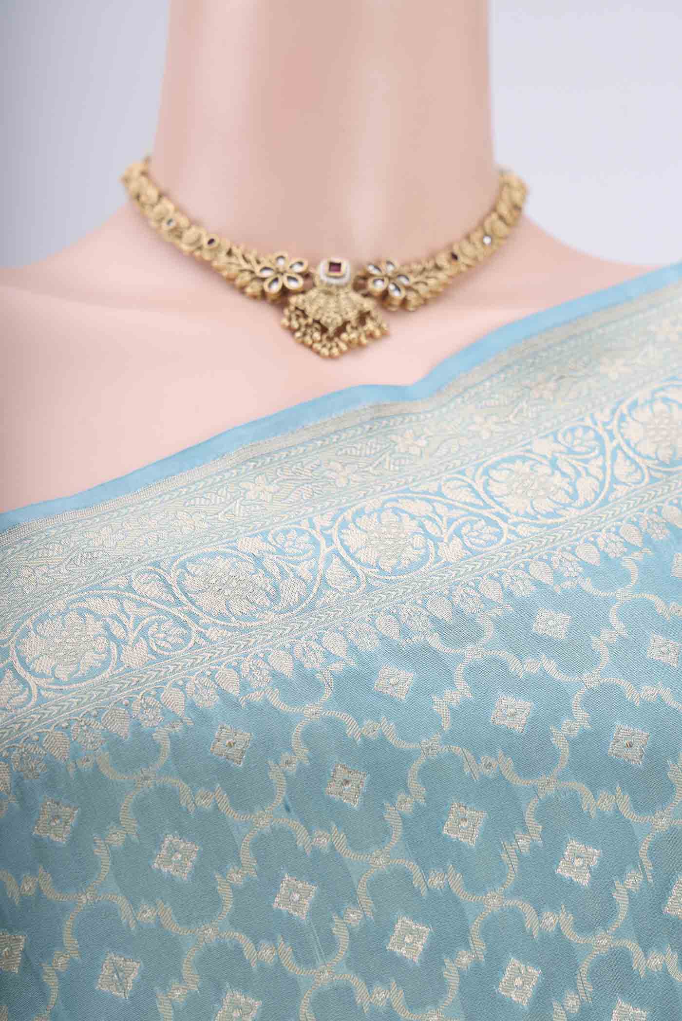 Border image of Sky Blue Banarasi Silk Saree with Zari And Thread Butta on the body and Zari Border. 