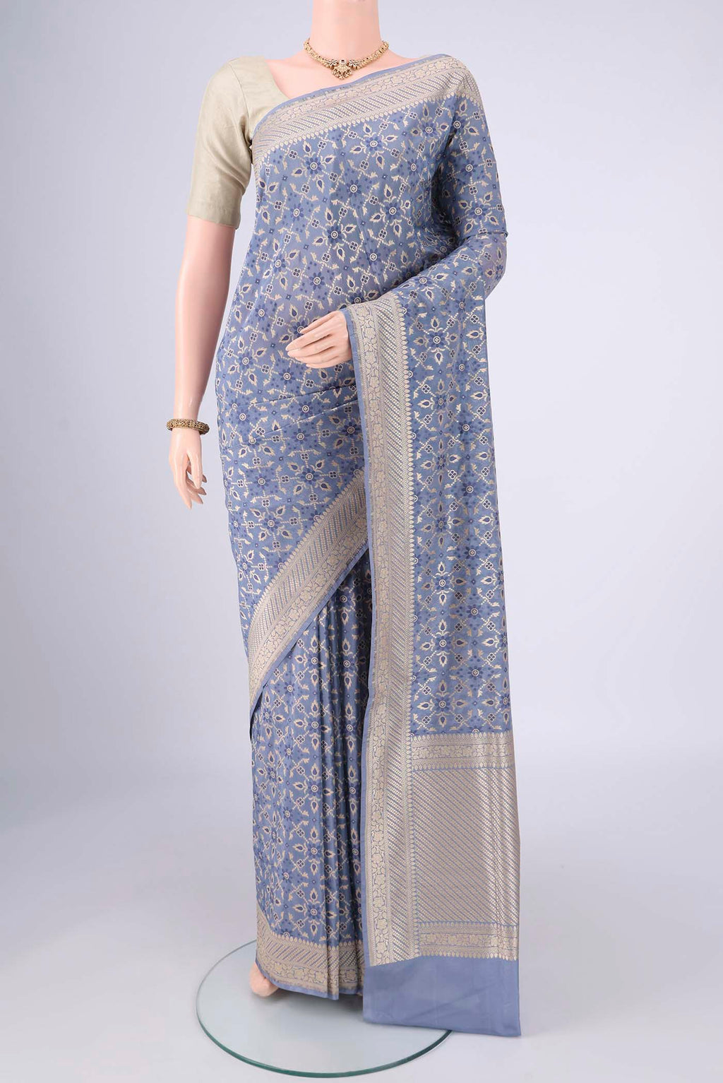 Blue Grey Banarasi Silk Saree with Zari Brocade on the body and Zari Border.  displayed on a mannequin