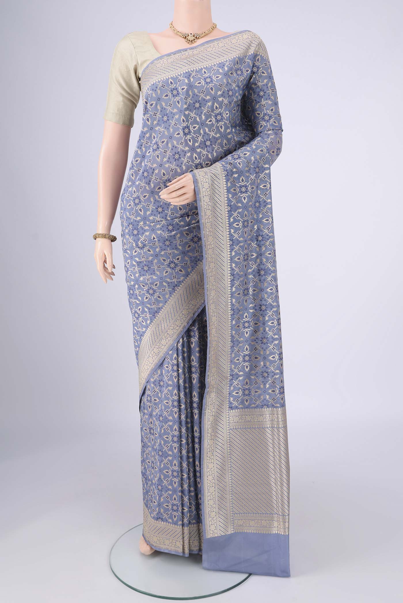 Blue Grey Banarasi Silk Saree with Zari Brocade on the body and Zari Border.  displayed on a mannequin