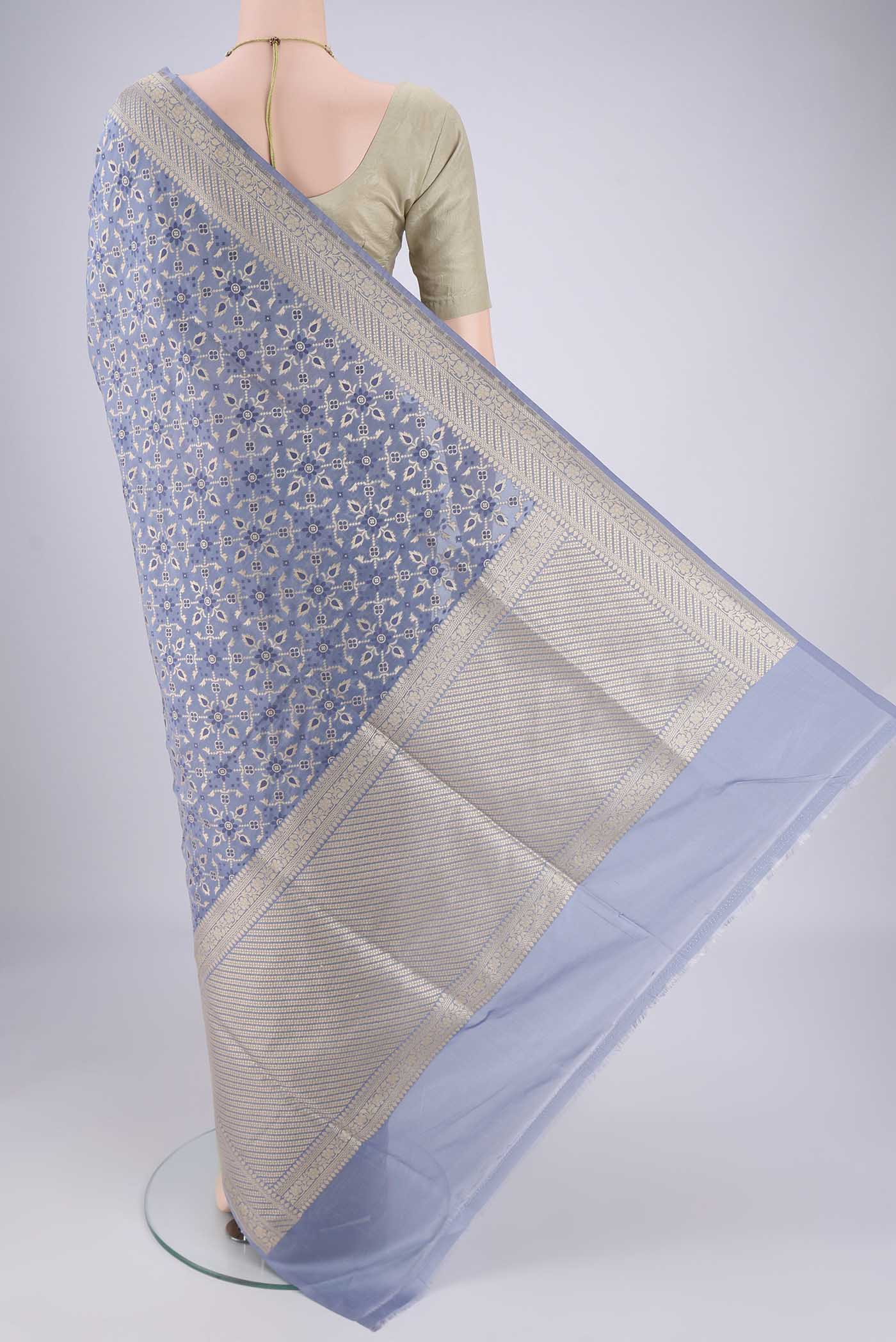 Flat view of Blue Grey Banarasi Silk Saree with Zari Brocade on the body and Zari Border. 