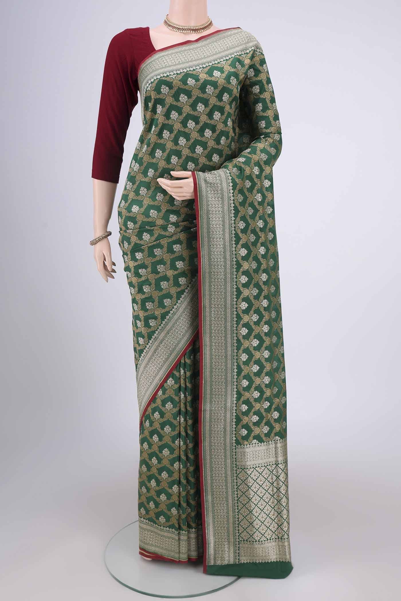 Green Dual Tone Banarasi Silk Saree with Jacquard With Zari Butta on the body and Zari Border.  displayed on a mannequin