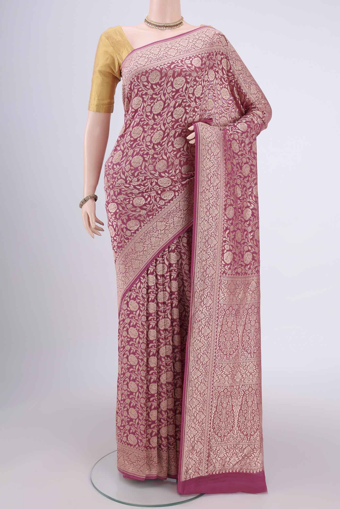 Pink Banarasi Georgette Saree with Zari Brocade on the body and Zari Border.  displayed on a mannequin
