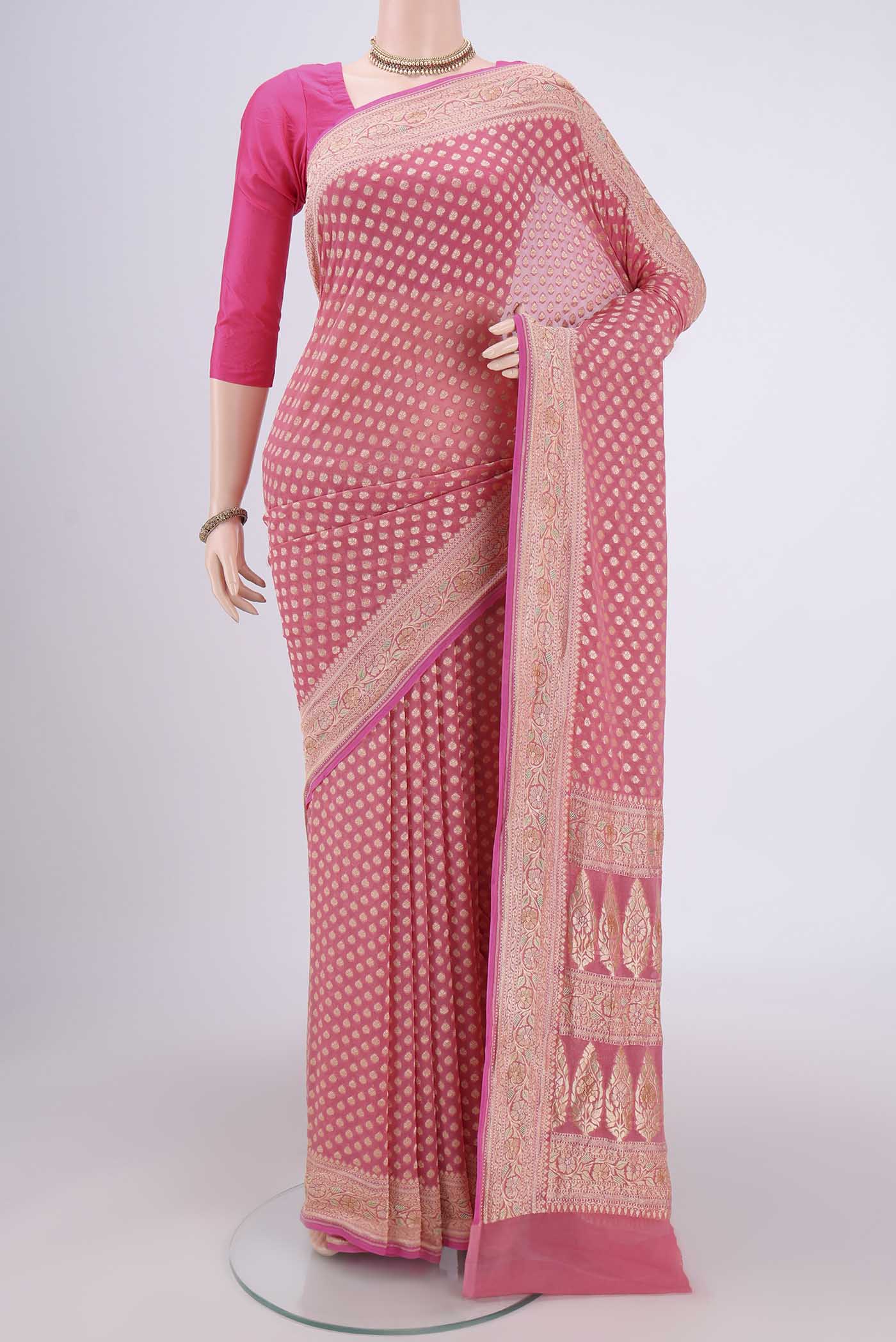 Pink Banarasi Georgette Saree with Zari Butta on the body and Zari Border.  displayed on a mannequin