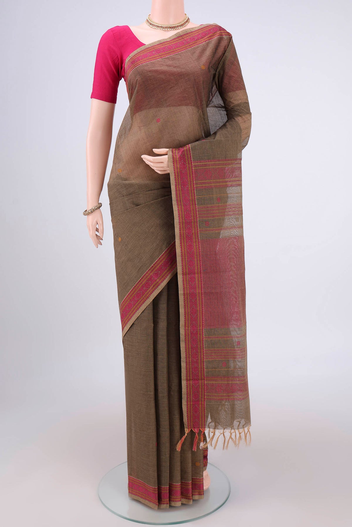 Davys Grey Kanchi Cotton Saree with Thread Butta on the body and Thread Border.  displayed on a mannequin