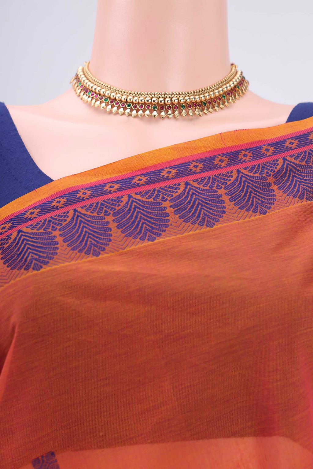 Border image of Orange Coimbatore Cotton Saree with Thread Butta on the body and Thread Border. 