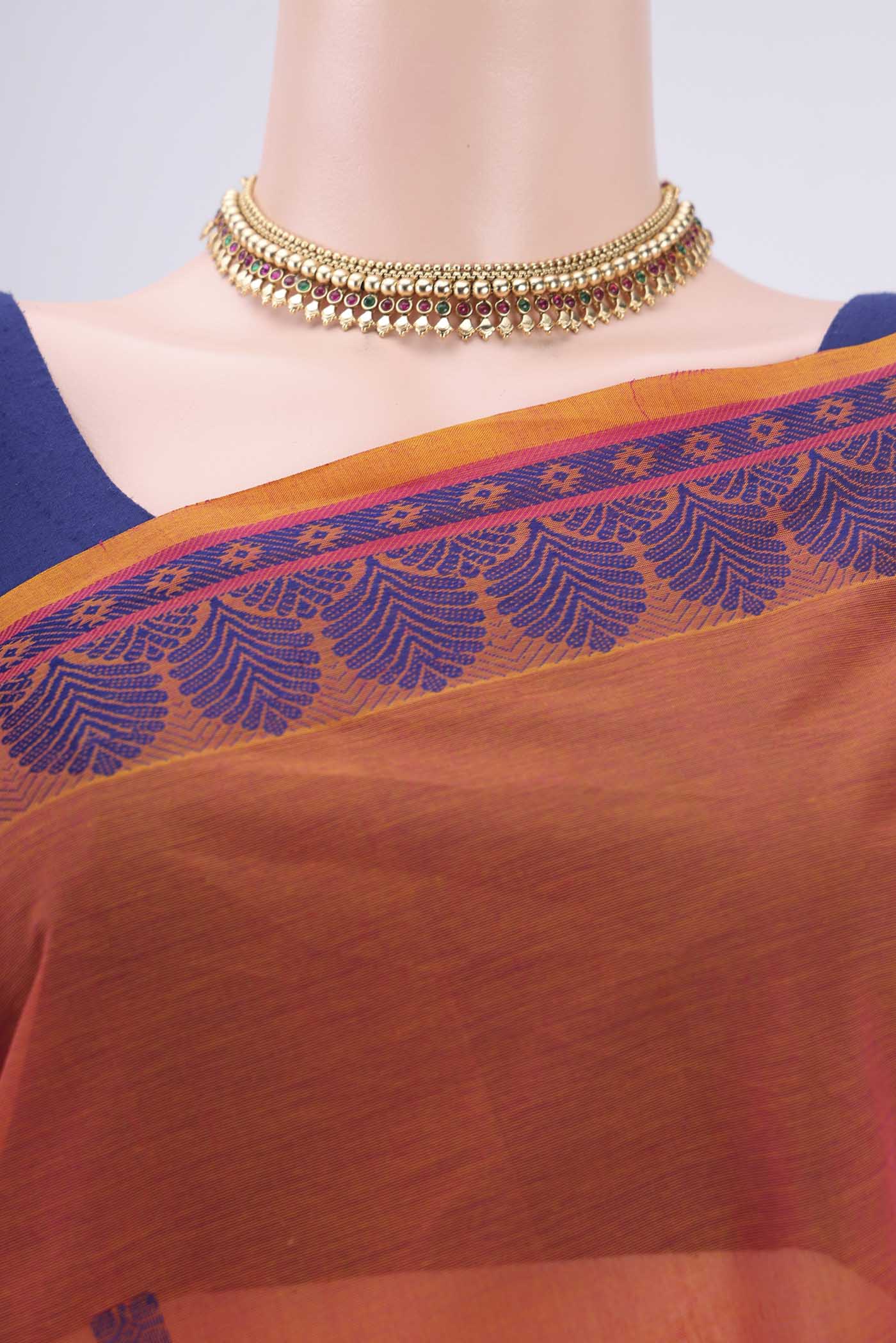 Border image of Orange Coimbatore Cotton Saree with Thread Butta on the body and Thread Border. 