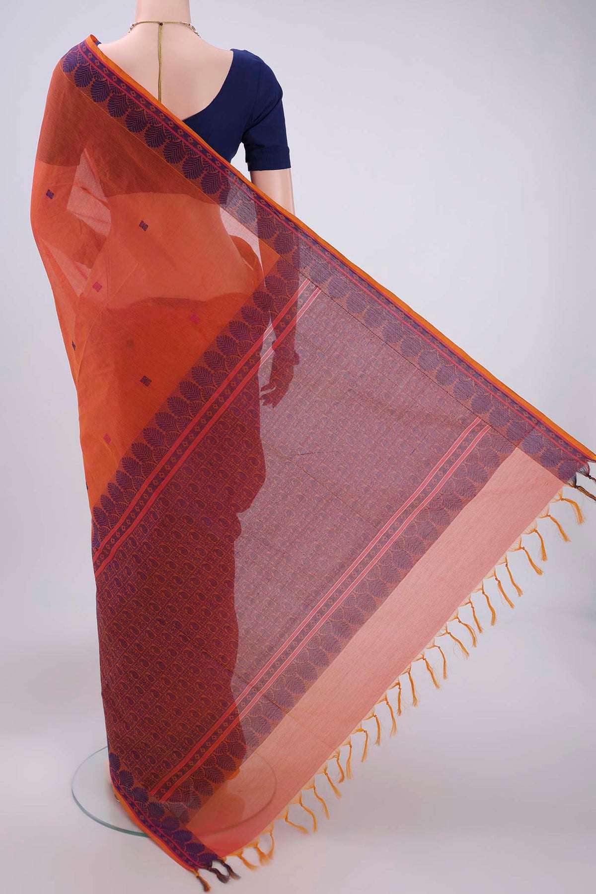 Flat view of Orange Coimbatore Cotton Saree with Thread Butta on the body and Thread Border. 