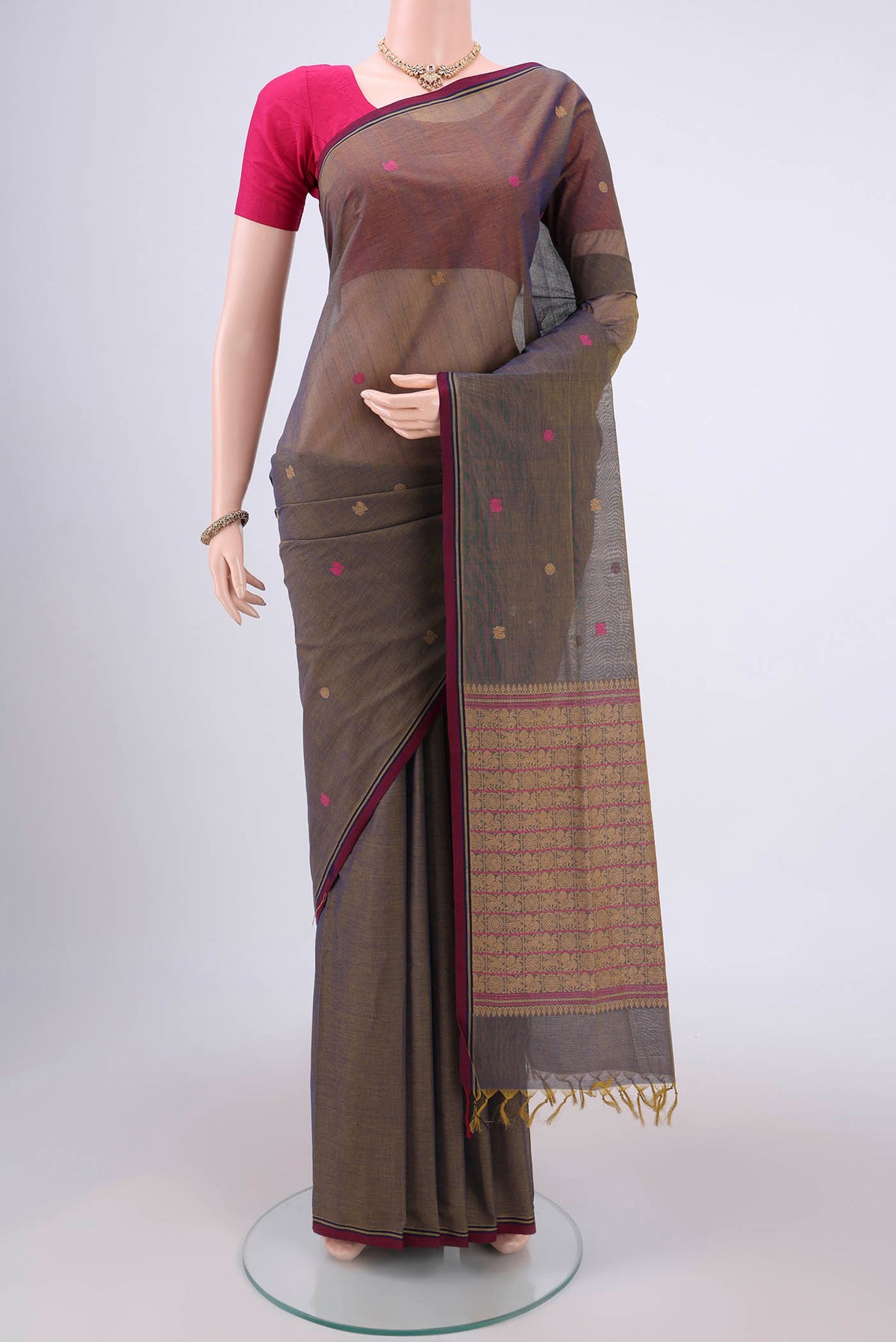 Blue Grey Coimbatore Cotton Saree with Thread Butta on the body and Thread Border.  displayed on a mannequin