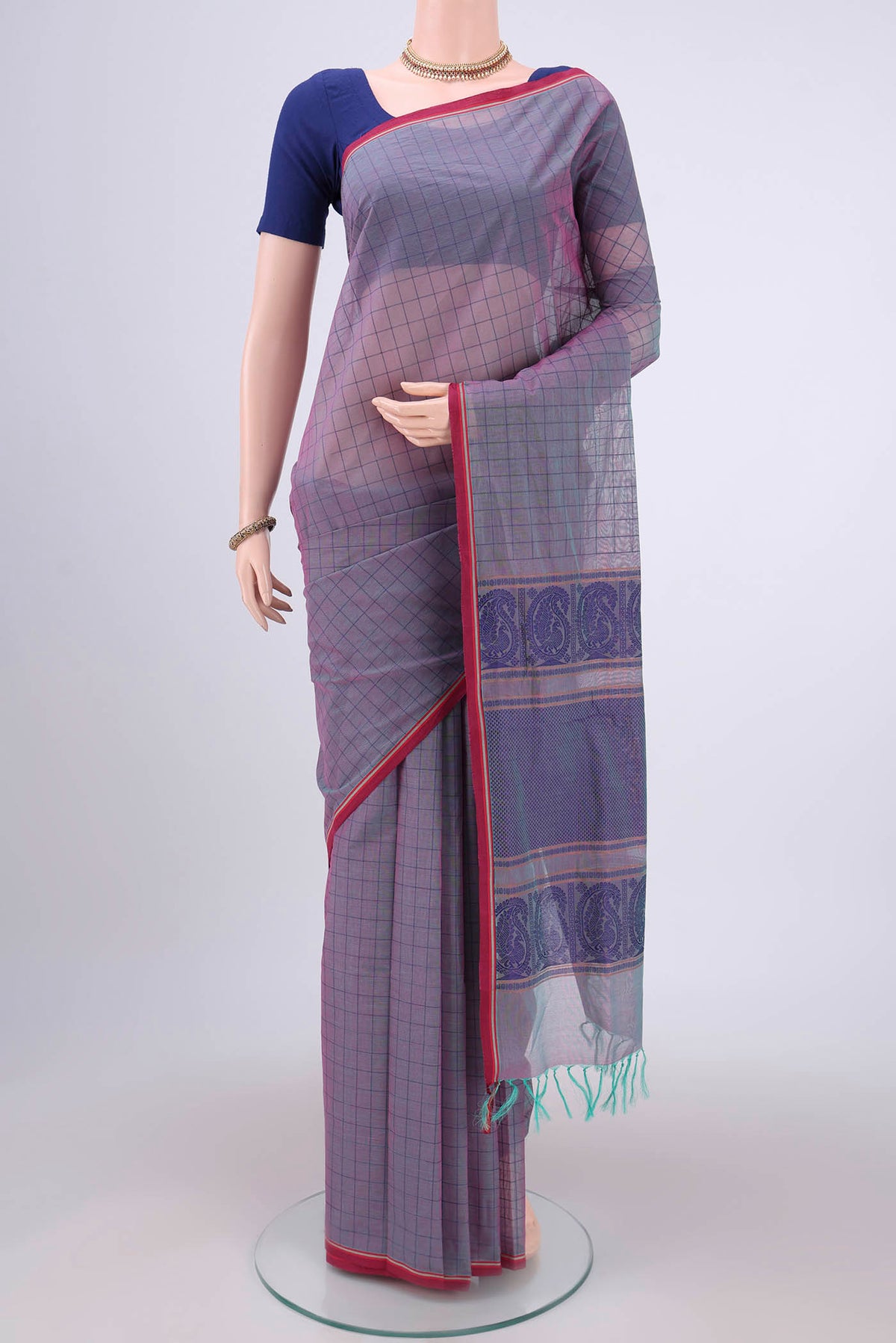 Purple Coimbatore Cotton Saree with Thread Butta on the body and Thread Border.  displayed on a mannequin