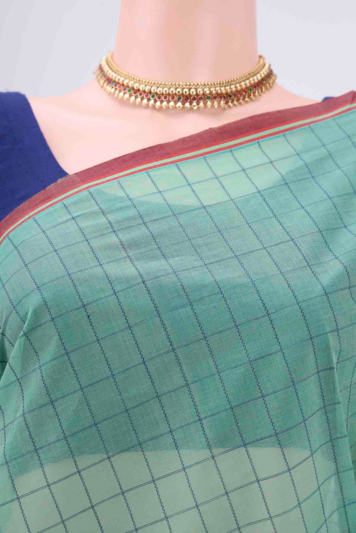 Border image of Mint Green Coimbatore Cotton Saree with Thread Butta on the body and Thread Border. 