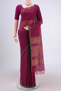 Magenta Coimbatore Cotton Saree with Thread Butta on the body and Thread Border.  displayed on a mannequin