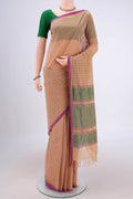 Beige Coimbatore Cotton Saree with Thread Butta on the body and Thread Border.  displayed on a mannequin