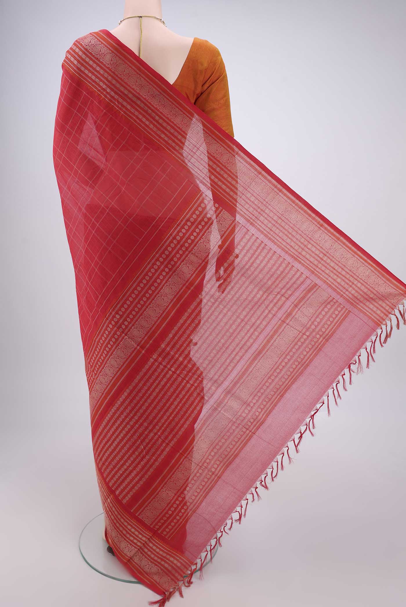 Flat view of Red Kanchi Cotton Saree with Checked design on the body and Thread Border. 
