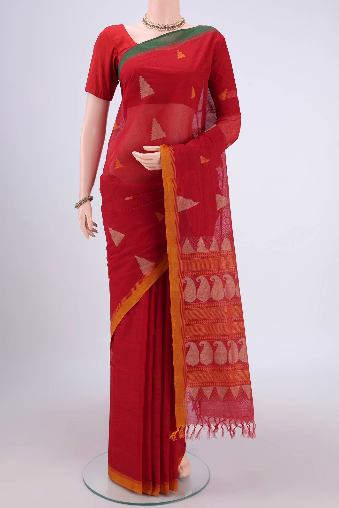 Deep Red Coimbatore Cotton Saree with Thread Butta on the body and Thread Border.  displayed on a mannequin