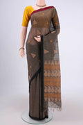 Black Coimbatore Cotton Saree with Thread Butta on the body and Thread Border.  displayed on a mannequin
