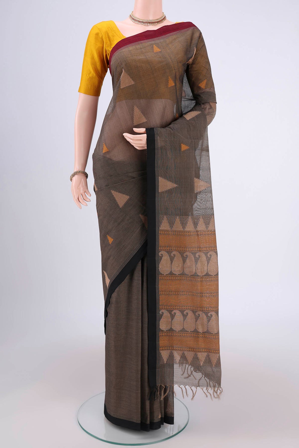 Black Coimbatore Cotton Saree with Thread Butta on the body and Thread Border.  displayed on a mannequin