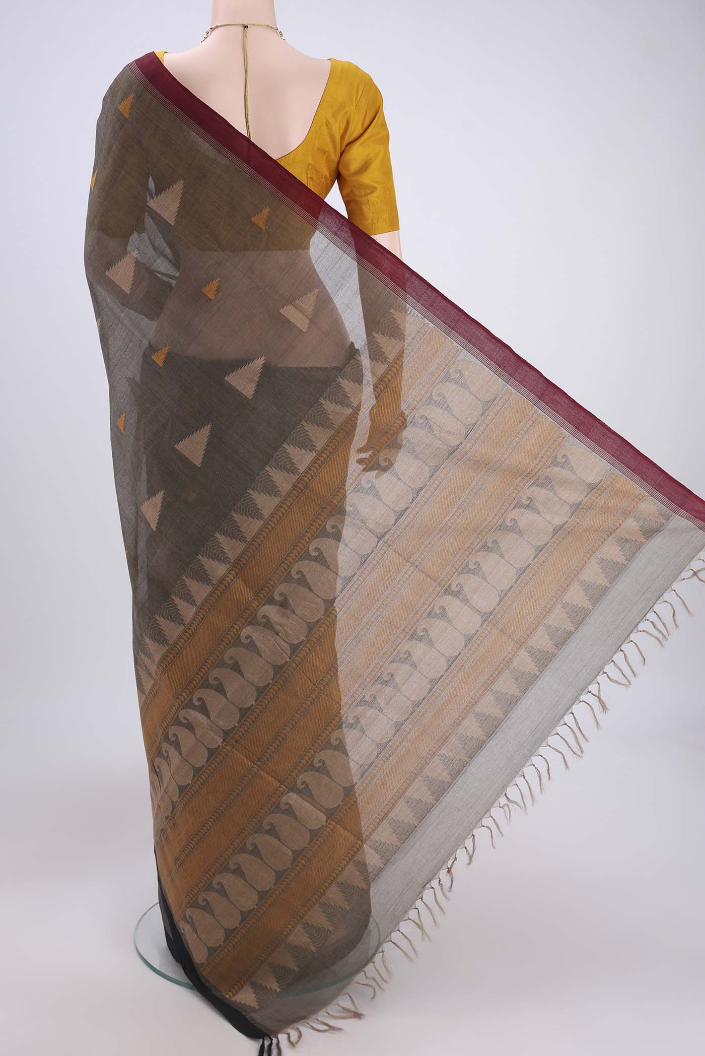 Flat view of Black Coimbatore Cotton Saree with Thread Butta on the body and Thread Border. 