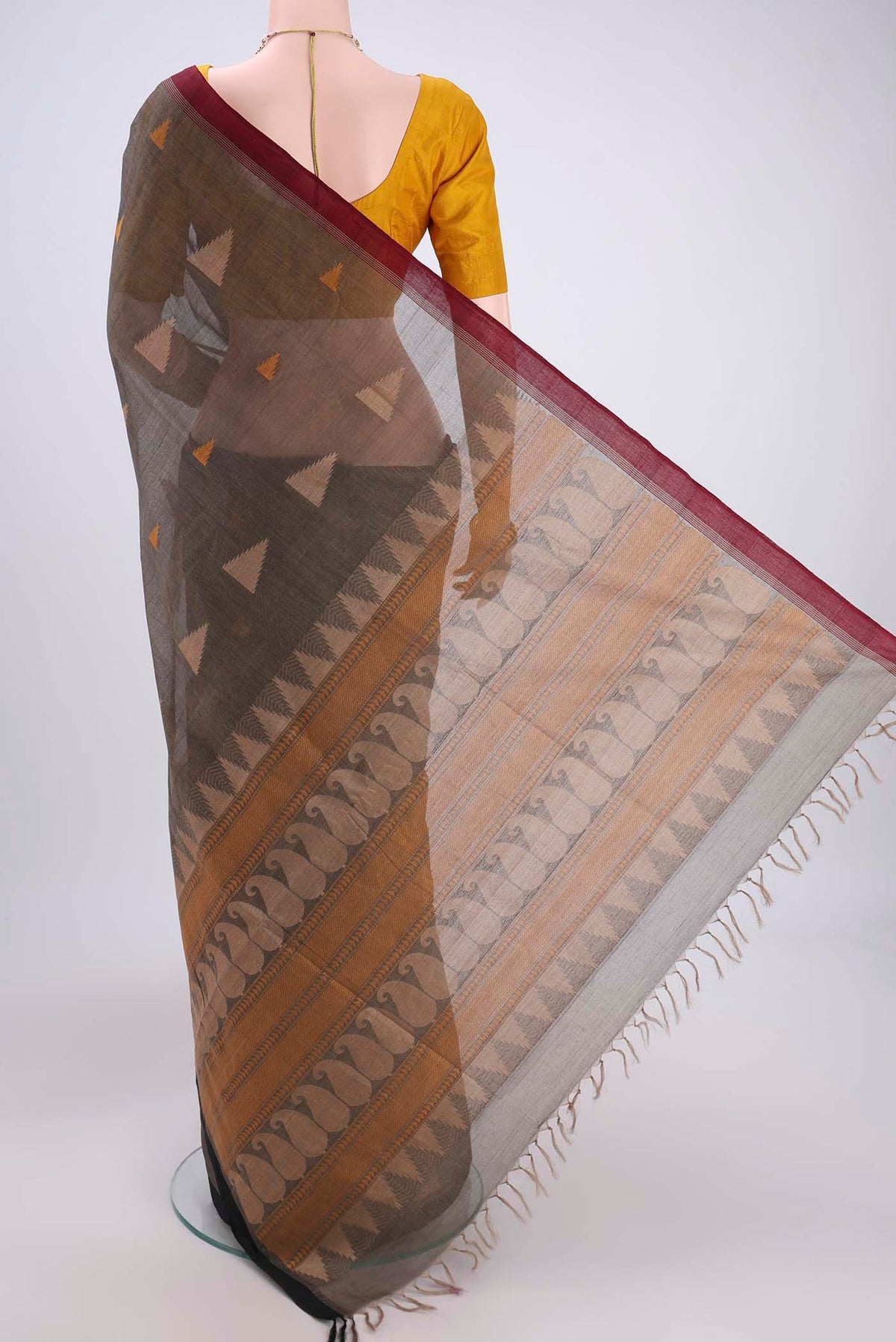 Flat view of Black Coimbatore Cotton Saree with Thread Butta on the body and Thread Border. 
