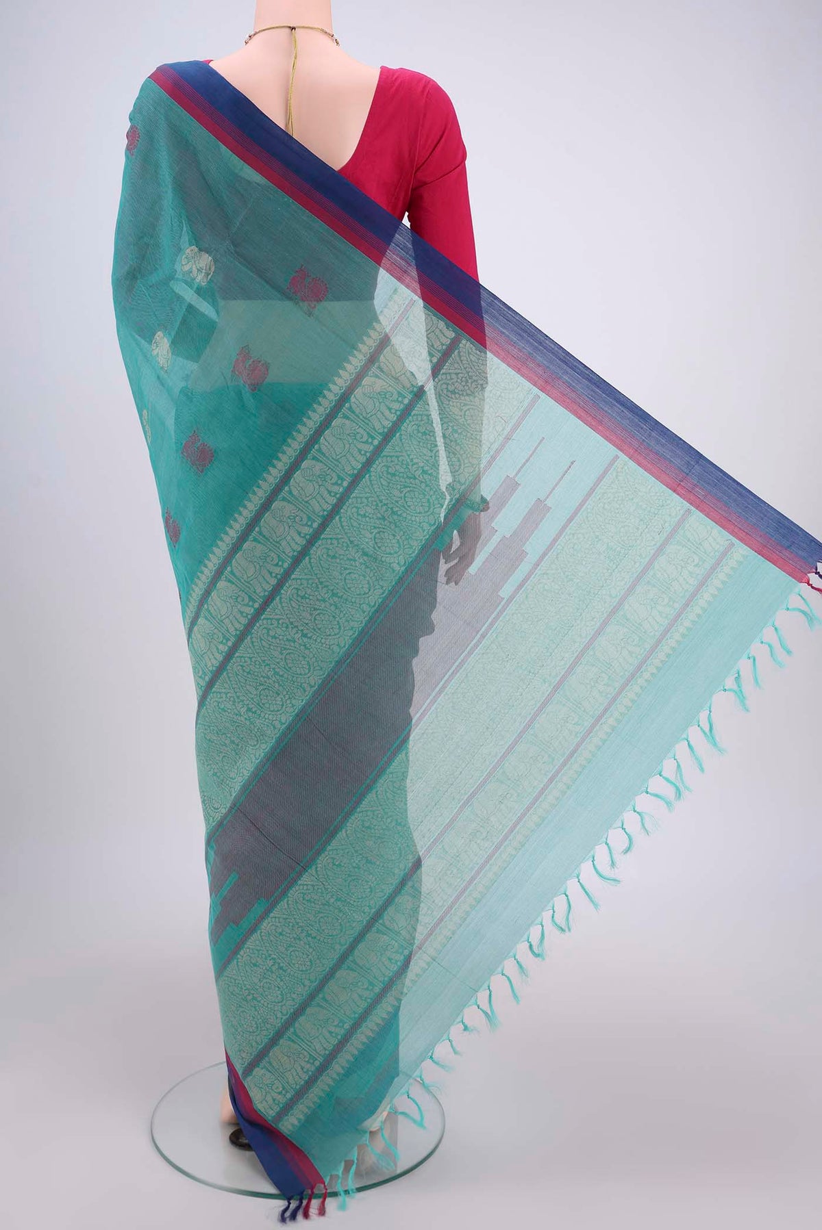 Flat view of Sea Green Kanchi Cotton Saree with Thread Butta on the body and Plain Border. 
