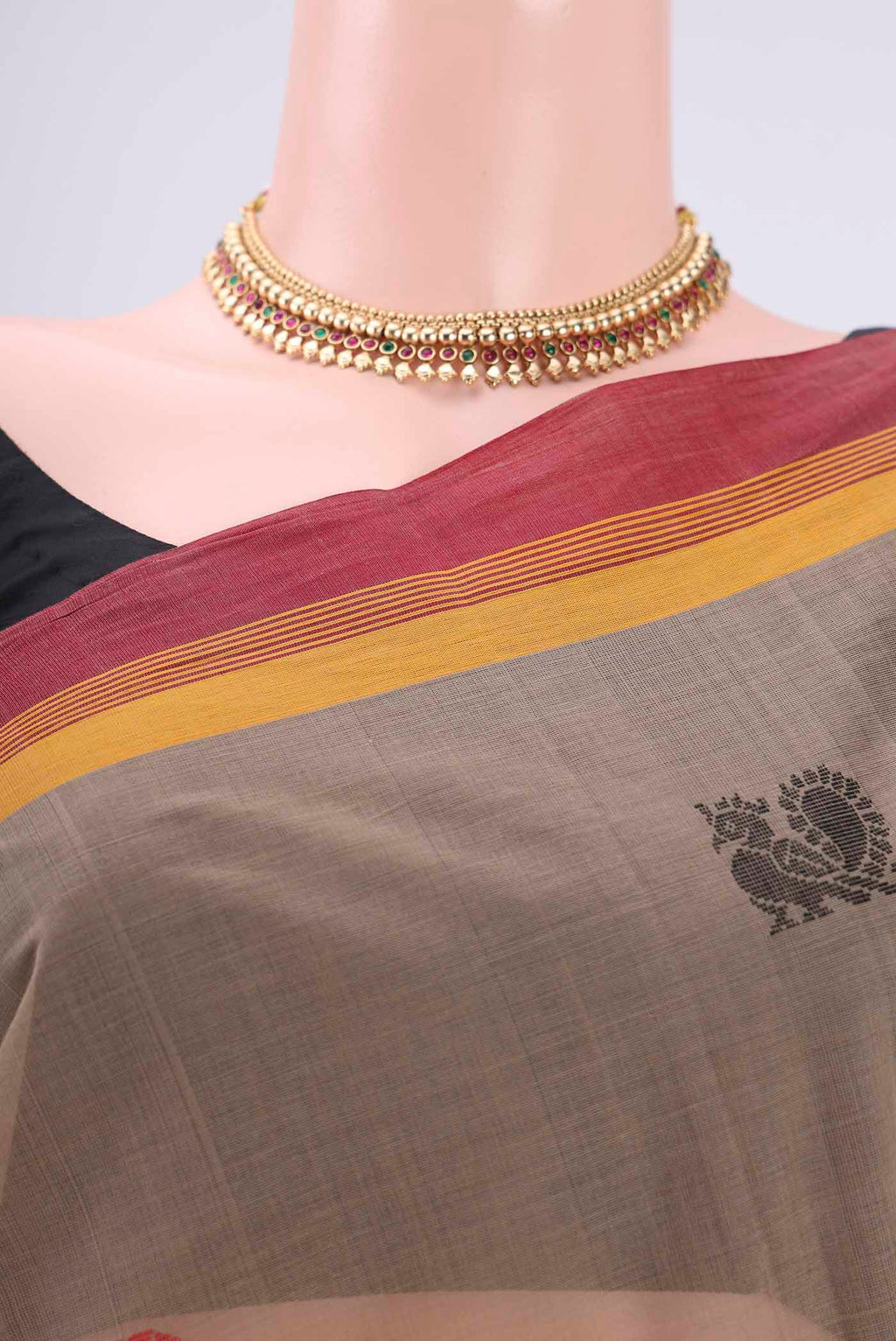 Border image of Brown Coimbatore Cotton Saree with Thread Butta on the body and Thread Border. 