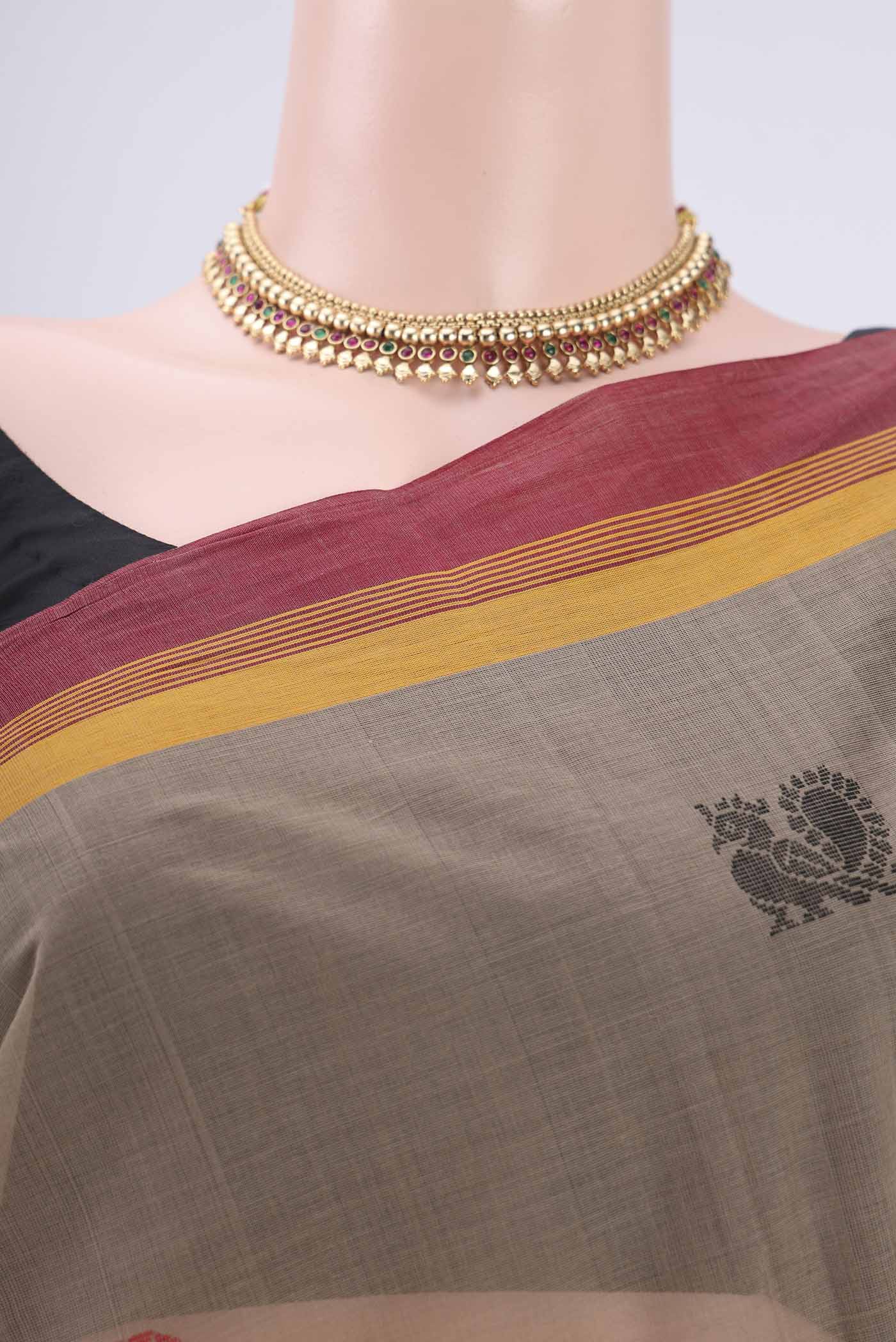 Border image of Brown Coimbatore Cotton Saree with Thread Butta on the body and Thread Border. 