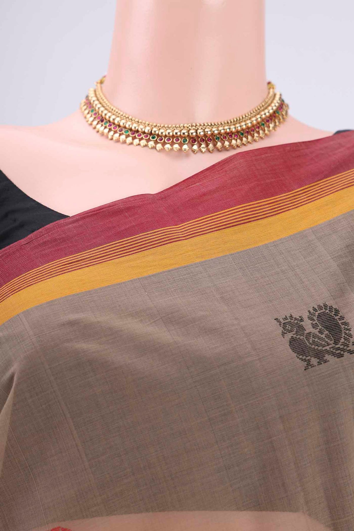 Border image of Brown Coimbatore Cotton Saree with Thread Butta on the body and Thread Border. 