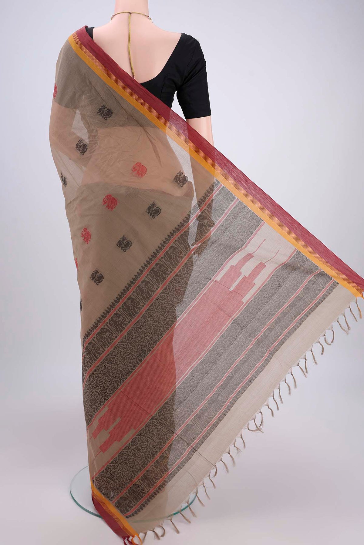 Flat view of Brown Coimbatore Cotton Saree with Thread Butta on the body and Thread Border. 